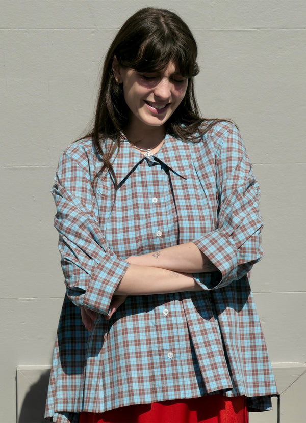 Woman in checked collared shirt from Daylight Moon